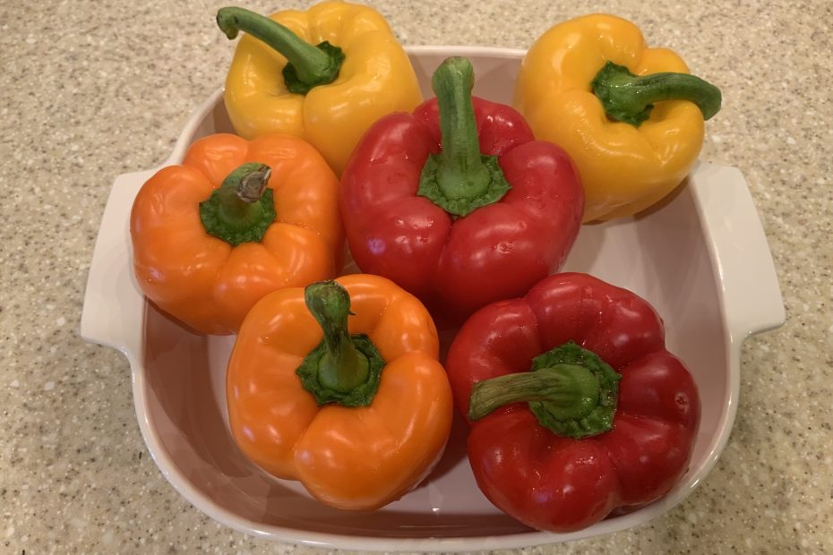 raw peppers in a baking dish